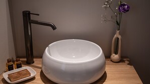 A bathroom sink with a modern faucet, a white basin, and a small soap dish with bar soap. - La Torre Belgirate - Luxury Rooms - Glicine - By Guestaly (Belgirate)