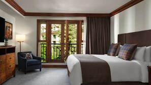 A hotel room with a bed, a chair, a desk, a lamp, and a view of the outside. - 2-bedroom residence in luxury resort with spa & nightly turn down service (Avon)
