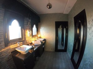 A bathroom with a large mirror, two sinks, and a light fixture. - Casa D'or  Dahab  (Dahab)