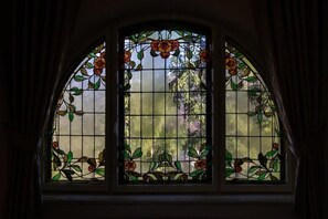 A stained glass window with floral patterns.