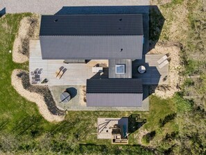 An aerial view of a modern building with a flat roof, a central courtyard, and outdoor seating areas. - "Ania" - 500m from the sea by Interhome (Løkken)