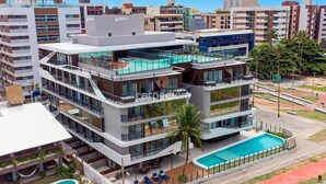 A multi-story hotel with a rooftop pool, balconies, and a swimming pool. - Azimut With Direct Beach Access and Sea View by Carpediem (Cabedelo)