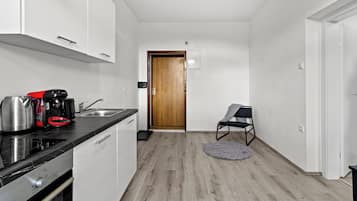 Apartamento conforto, 1 cama Queen | Cozinha privada