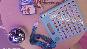 A table with a blue lanyard, communication cards, a lanyard keychain, and a decorative globe. - Rothbury House, Luxury Family Retreat with Hot tub and Playframe (Nortumberland)