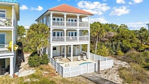 A two-story beachfront house with a balcony, a pool, and a wooden deck. - Beach Front- St George Island -Pool -Game Room (Saint George Island)