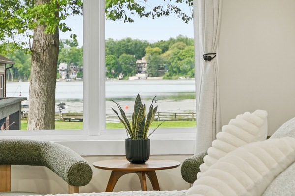 Primary bedroom lake view window — wake up to the water