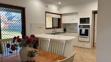 Coffee/tea maker, fridge, microwave, oven