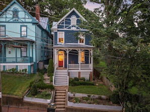 A two-story house with a porch and a front door. - Hilltop Hideaway (Staunton)