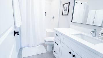 Shower, towels, soap, toilet paper
