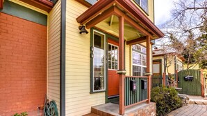 A house with a porch, steps, a mailbox, and a garden hose. - The Terrace 2 BR near the courthouse square with a King bed in the master BR (Prescott)
