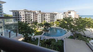 A modern hotel with a pool, multiple floors, and a view of the sea. - CASA PARAISO: Spacious 3-bedroom cozy apartment just a few meters from the ocean (Chame)
