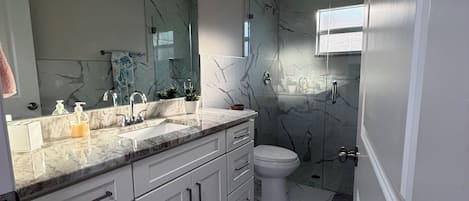 Shower, hair dryer, towels, soap