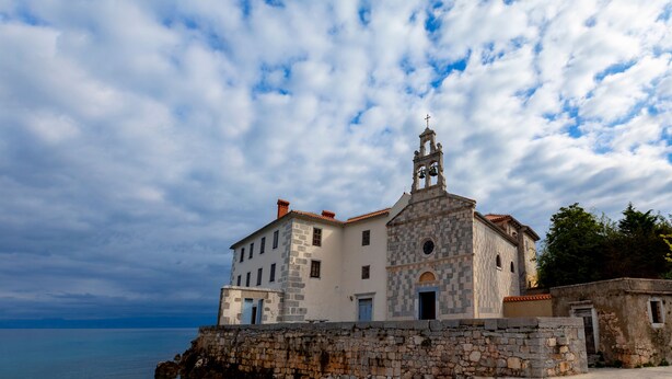 A coastal building with a bell tower, stone walls, and a clear view of the sea. - Wabi Sabi Apt2 Pool & Garden, Brzac, Croatia (Brzac)