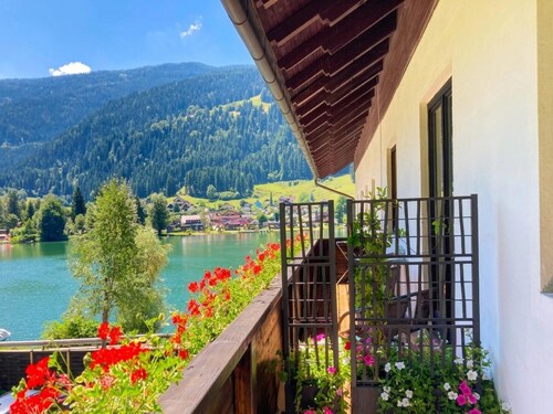 Apartment with private beach at an Alpine lake