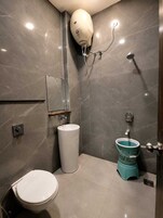Combined shower/tub, slippers, towels, soap