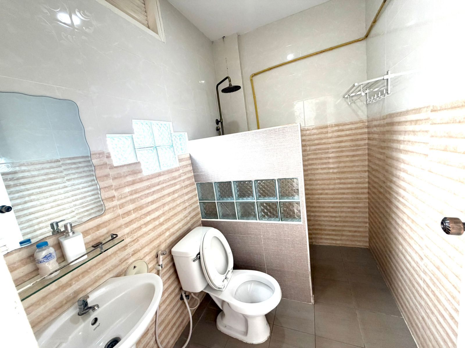 Shower, hair dryer, slippers, towels