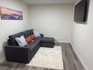 Living area - Dykee Brand new 1 Bedroom 1 bath suite with sofa bed, in the Greens, Regina.SK (Regina)