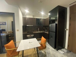 Deluxe Suite, River View | Private kitchen - Zivana Luxury Hotel - Lumiere Riverside (An Khanh)