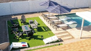 A backyard with a pool, outdoor furniture, and a patio area. - 4-bdrm home with 2 Master Suites & Heated Pool minutes from Old Town Scottsdale (Scottsdale)