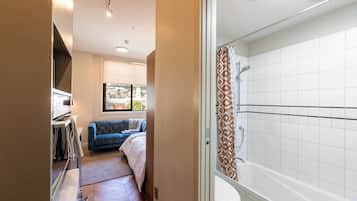 Shower, hair dryer, towels, shampoo