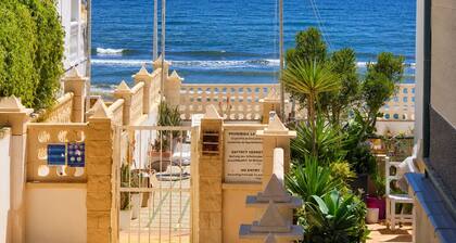Andalusia, beachfront apartment, pool, terrace, parking.