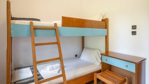 A bunk bed with a wooden ladder, a desk with drawers, and a small chair. - Villa Anty Holiday Home in Sani, Chalkidiki—Private Terrace & Pine Forest Views (Sane)
