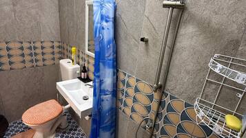 Quadruple Room, Garden View | Bathroom | Shower, towels, soap, toilet paper