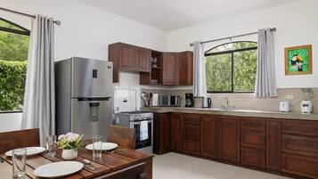 Coffee/tea maker, fridge, microwave, oven