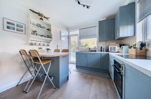 Private kitchen - Points, an art deco Wittering family seaside holiday home for 10 guests (East Wittering)