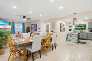 A modern kitchen with grey cabinets, a built-in oven, and a countertop with a sink. - 3bd golf cart, pool, close to beach (Indian Rocks Beach)