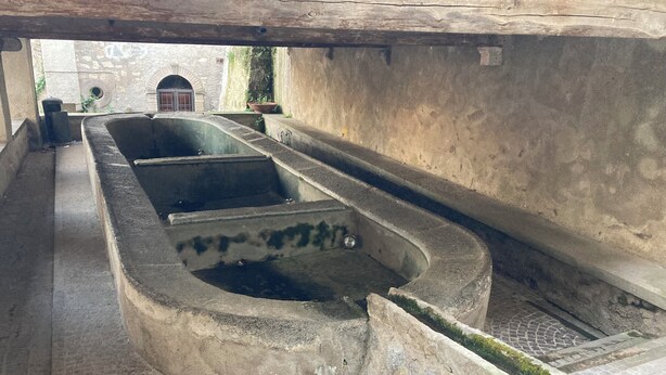 A narrow, stone-lined water channel with steps leading down to a lower level. - The House of Mina is in the heart of the small village of Carbognano in Tuscia (Carbognano)