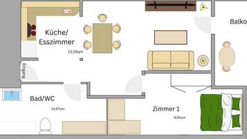 Un hôtel proposant des chambres avec cuisine/coin repas, salle de bain, balcon et deux chambres.