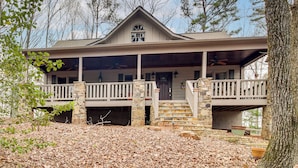 A two-story house with a stone foundation, a balcony, and a front porch. - Private Hot Tub, Community Perks! Big Canoe Escape (Jasper)