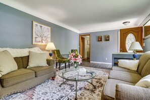 A living room with a sofa, armchairs, a coffee table, and a patterned rug. - Deck & Shared Yard! Relaxing South Saint Paul Home (South St. Paul)