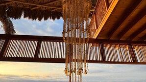 A covered outdoor seating area with a view of the sea and a pool. - w Relaxing Oceanfront 5BR in Punta Veleros (Los Organos)