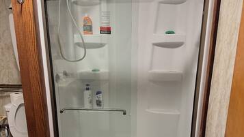 Shower, towels, soap, toilet paper