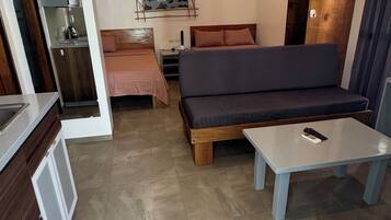 Deluxe Double or Twin Room, Balcony, Pool View | Living area