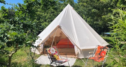 Bell tent in a natural, bucolic garden