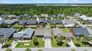 A residential neighborhood with houses, lawns, and a playground. - 4BR Foley Home Near OWA and Beaches (Foley)