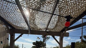 A covered outdoor patio with seating, a table, and a grill. - Marseille: sea and garden views at Endoume! (Marseille)