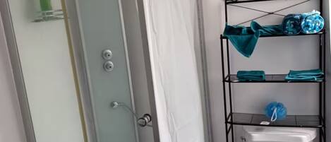 Shower, towels, soap, toilet paper