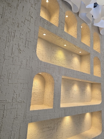 A modern interior with textured walls and recessed lighting.. Amazonia Luxury