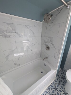 Shower, hair dryer, towels, soap