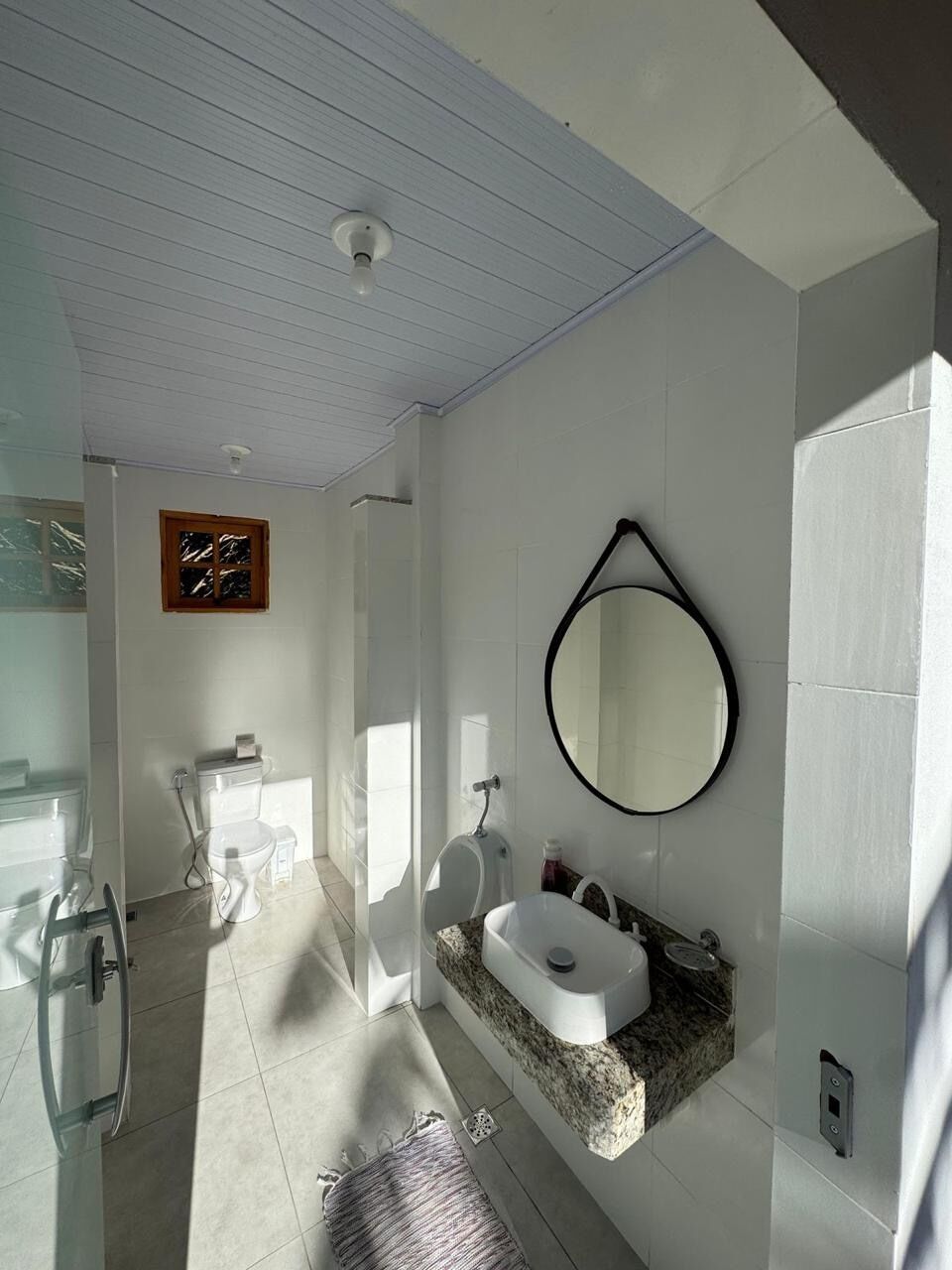 Shower, hair dryer, soap, toilet paper