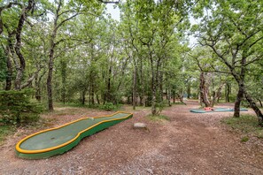 A forested area with a miniature golf course. - Ardeche Holiday Apartment for 4 (Grospierres)