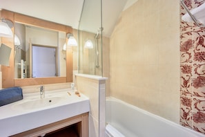 A bathroom with a sink, mirror, and shower. - Luxe Normandy Duplex for 8 With Pool (Houlgate)