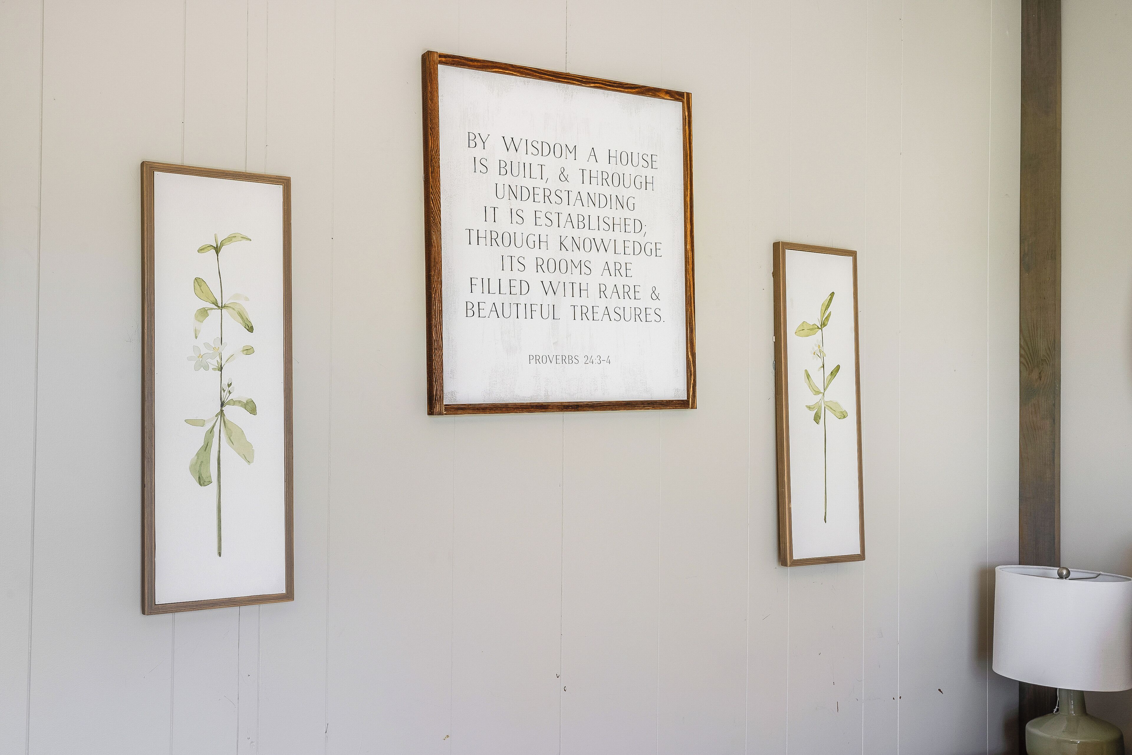 Three framed botanical prints on a wall.