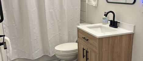 Jetted bath, hair dryer, towels, soap