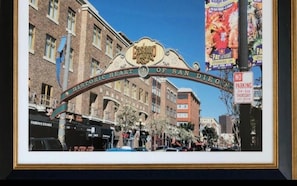 A framed picture of the Historic Heart of San Diego sign with a clear view of the surrounding buildings and a 'No Parking' sign.
