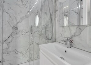 Shower, eco-friendly toiletries, hair dryer, towels